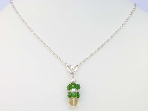 Chloe necklace. Russian diopsides, with a white freshwater cultured pearl and citrine. Suspended from a polished sterling silver handmade heart on a sterling silver chain. Sweet Heart Collection. 47cm. Jewellery by Linda