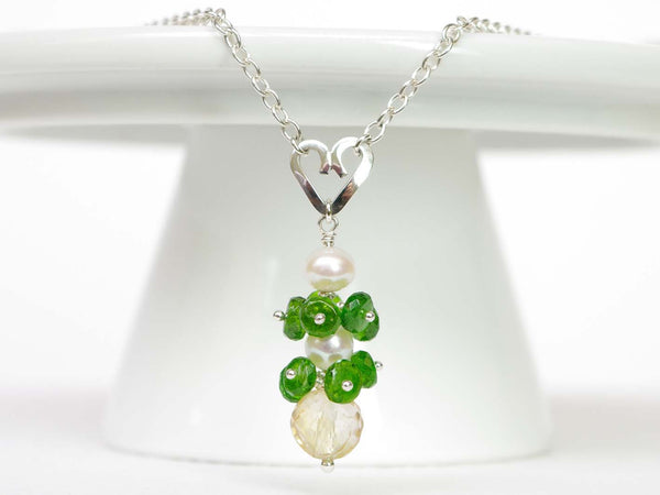 Chloe necklace. Russian diopsides, with a white freshwater cultured pearl and citrine. Suspended from a polished sterling silver handmade heart on a sterling silver chain. Sweet Heart Collection. Jewellery by Linda