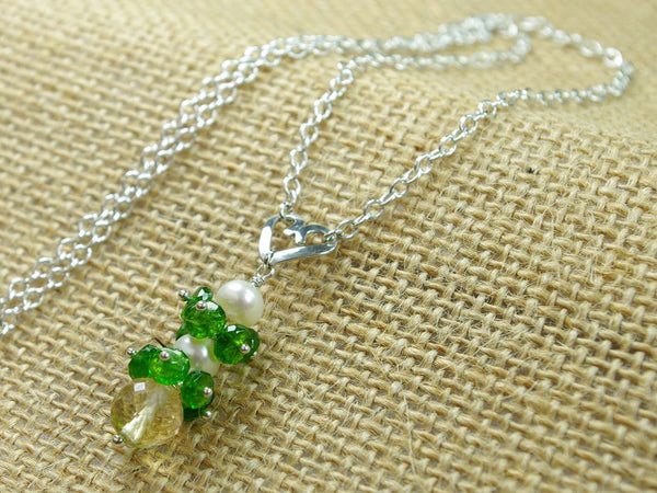 Chloe necklace. Russian diopsides, with a white freshwater cultured pearl and citrine. Suspended from a polished sterling silver handmade heart on a sterling silver chain. Jewellery by Linda Sweet Heart Collection. 47cm chain. 3.5cm pendant