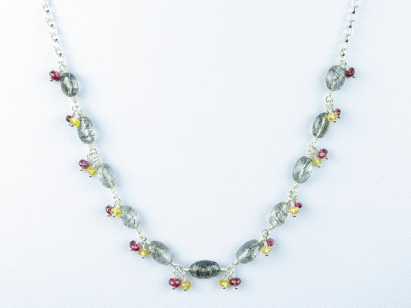 Elegance necklace. Rutile quartz, yellow sapphire, red spinel, silver.