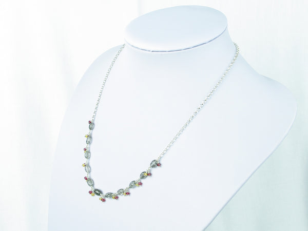 Elegance necklace. Rutile quartz, yellow sapphire, spinel, silver.