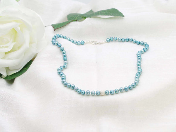 Elegant single strand of teal hand knotted pearls featuring a stardust sterling silver sphere from Jewellery by Linda. Sophisticated vintage inspired glamour