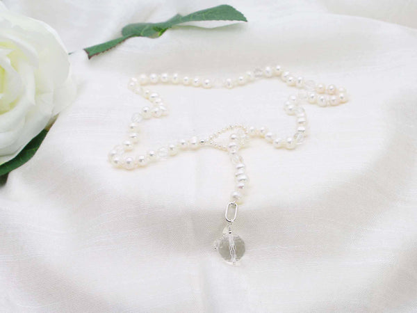 Statement lariat style single strand of ivory potato pearls sprinkled with micro faceted clear quartz.  Exquisite glamorous necklace from Jewellery by Linda