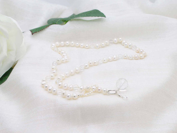 Glamorous lariat style single strand of ivory potato pearls sprinkled with micro faceted clear quartz.  Exquisite statement necklace from Jewellery by Linda
