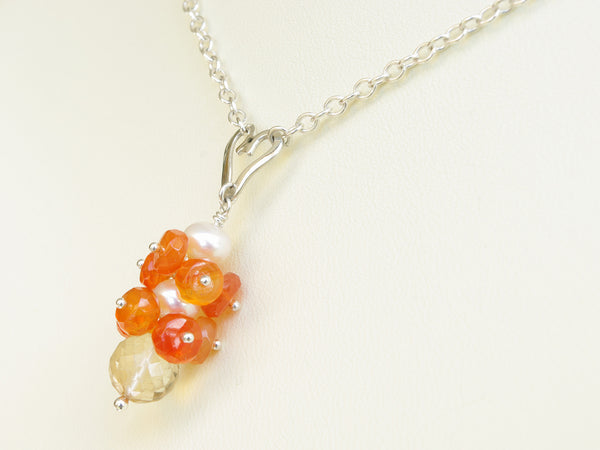 Lalita necklace. Carnelians with a white freshwater cultured pearl and citrine. Suspended from a polished sterling silver handmade heart on a sterling silver chain. Sweet Heart Collection. 46cm chain. 3.5cm pendant