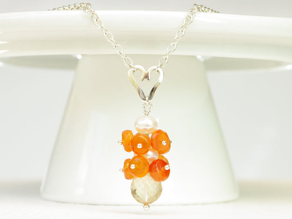 Lalita necklace. Carnelians with a white freshwater cultured pearl and citrine. Suspended from a polished sterling silver handmade heart on a sterling silver chain. Sweet Heart Collection. 46cm chain. 3.5cm pendant