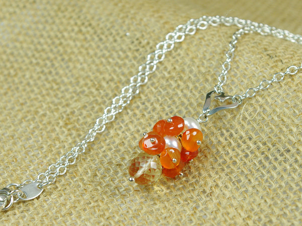 Lalita necklace. Carnelians with a white freshwater cultured pearl and citrine. Suspended from a polished sterling silver handmade heart on a sterling silver chain. Sweet Heart Collection. 46cm chain. 3.5cm pendant