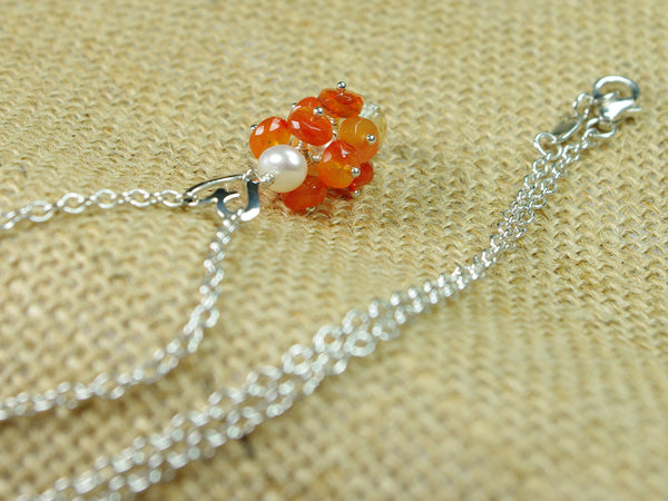 Lalita necklace. Carnelians with a white freshwater cultured pearl and citrine. Suspended from a polished sterling silver handmade heart on a sterling silver chain. Sweet Heart Collection. 46cm chain. 3.5cm pendant