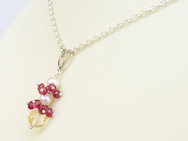Roslyn necklace. Red spinel with a white freshwater cultured pearl and citrine. Suspended from a polished sterling silver handmade heart on a sterling silver chain. Sweet Heart Collection. 46cm chain. 3.5cm pendant