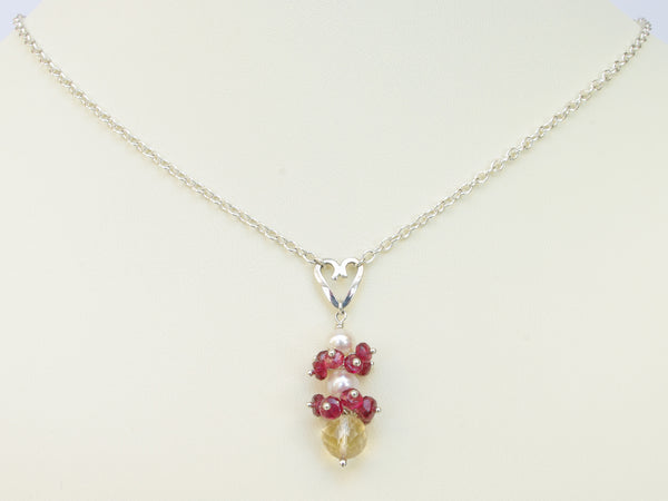 Roslyn necklace. Red spinel with a white freshwater cultured pearl and citrine. Suspended from a polished sterling silver handmade heart on a sterling silver chain. Sweet Heart Collection. 46cm chain. 3.5cm pendant
