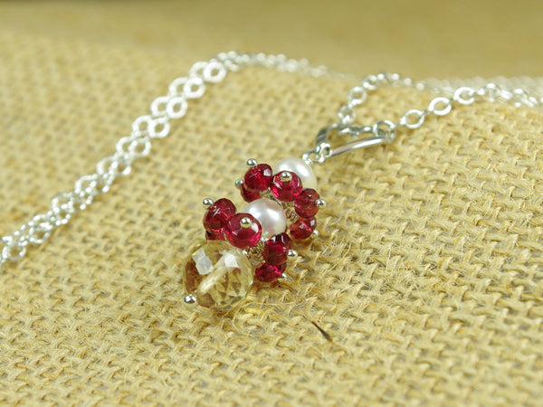 Roslyn necklace. Red spinel with a white freshwater cultured pearl and citrine. Suspended from a polished sterling silver handmade heart on a sterling silver chain. Sweet Heart Collection. 46cm chain. 3.5cm pendant