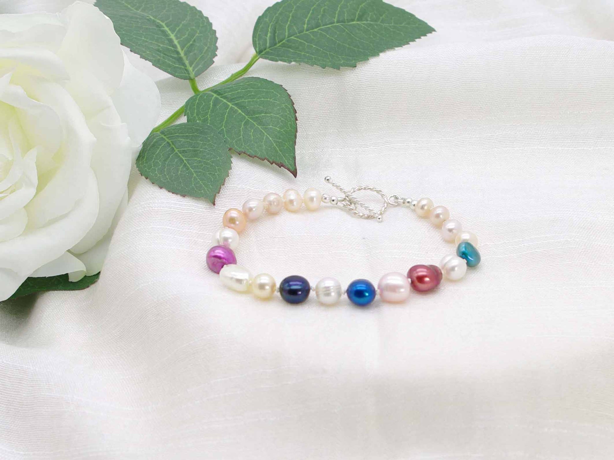 Multitude colourful hand knotted pearl bracelet featuring a sterling silver toggle clasp from Jewellery by Linda