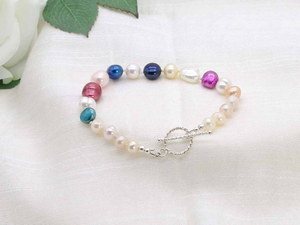 Multitude colourful hand knotted pearl bracelet with rope design sterling silver toggle clasp from Jewellery by Linda