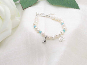 Cute Maritime bracelet with hand knotted ivory pearls and larimar. Featuring sterling silver maritime charms. From Jewellery by Linda