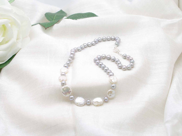 Contemporary distinctive hand knotted silver grey pearl necklace with striking iridescent silver coin pearls