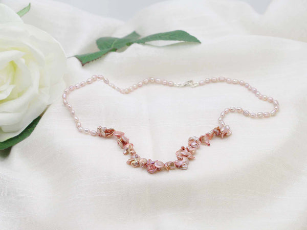 Exclusive single strand of hand knotted antique rose rice pearls with a contemporary feature of copper shaded keishi pearls from Jewellery by Linda