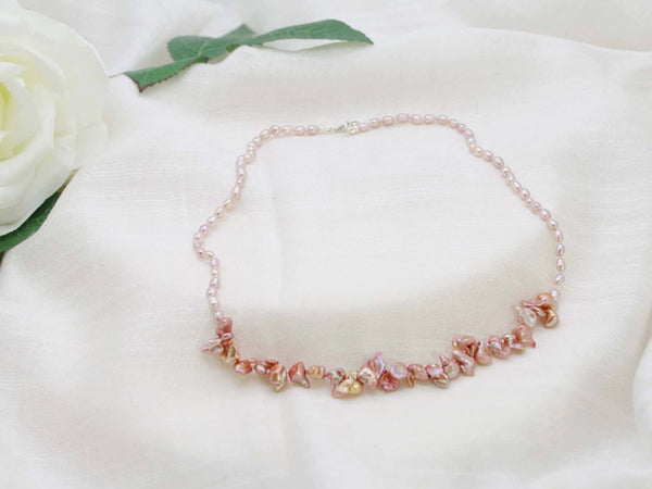 Vintage inspired single strand of hand knotted antique rose rice pearls with a contemporary feature of copper shaded keishi pearls from Jewellery by Linda. Contemporary twist on a classic.