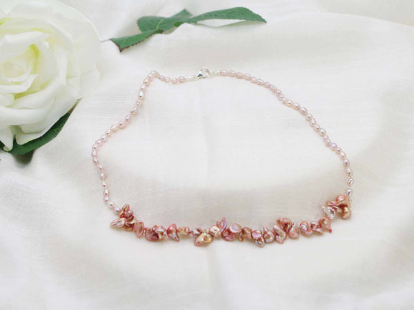 Distinctive single strand of hand knotted antique rose rice pearls with a contemporary feature of copper shaded keishi pearls from Jewellery by Linda