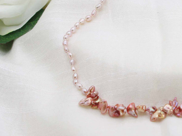 Exclusive single strand of hand knotted antique rose rice pearls with a contemporary feature of copper shaded keishi pearls from Jewellery by Linda. Light to wear one of a kind pearl necklace