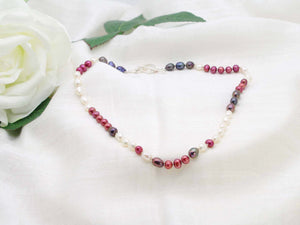 Very Berry hand knotted single strand of pearls in berry colours. Distinctive contemporary glamour from Jewellery by Linda