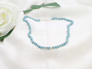 Elegant single strand of teal hand knotted pearls featuring a stardust sterling silver sphere from Jewellery by Linda
