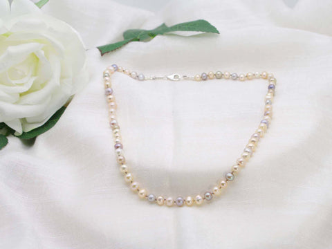 Single graceful strand of hand knotted pearls in subtle sophisticated tones. Classic necklace from Jewellery by Linda. Refined necklace  which is light and comfortable to wear with a vintage vibe
