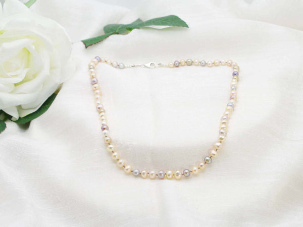 Single sophisticated strand of hand knotted pearls in subtle sophisticated tones. Classic necklace from Jewellery by Linda
