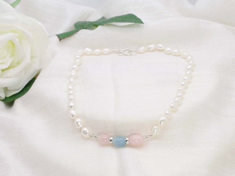 Luxury  single strand of white baroque hand knotted pearls featuring sublime aquamarine and morganite tumbled gemstones - sumptuous flattering necklace for the woman who has everything. From Jewellery by Linda
