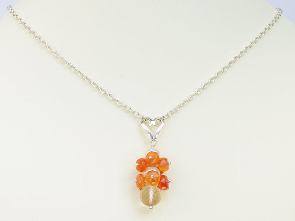Lalita necklace. Carnelians with a white freshwater cultured pearl and citrine. Suspended from a polished sterling silver handmade heart on a sterling silver chain. Sweet Heart Collection. 46cm chain. 3.5cm pendant