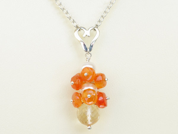 Lalita necklace. Carnelians with a white freshwater cultured pearl and citrine. Suspended from a polished sterling silver handmade heart on a sterling silver chain. Sweet Heart Collection. 46cm chain. 3.5cm pendant