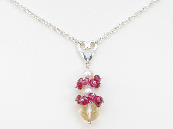 Roslyn necklace. Red spinel with a white freshwater cultured pearl and citrine. Suspended from a polished sterling silver handmade heart on a sterling silver chain. Sweet Heart Collection. 46cm chain. 3.5cm pendant