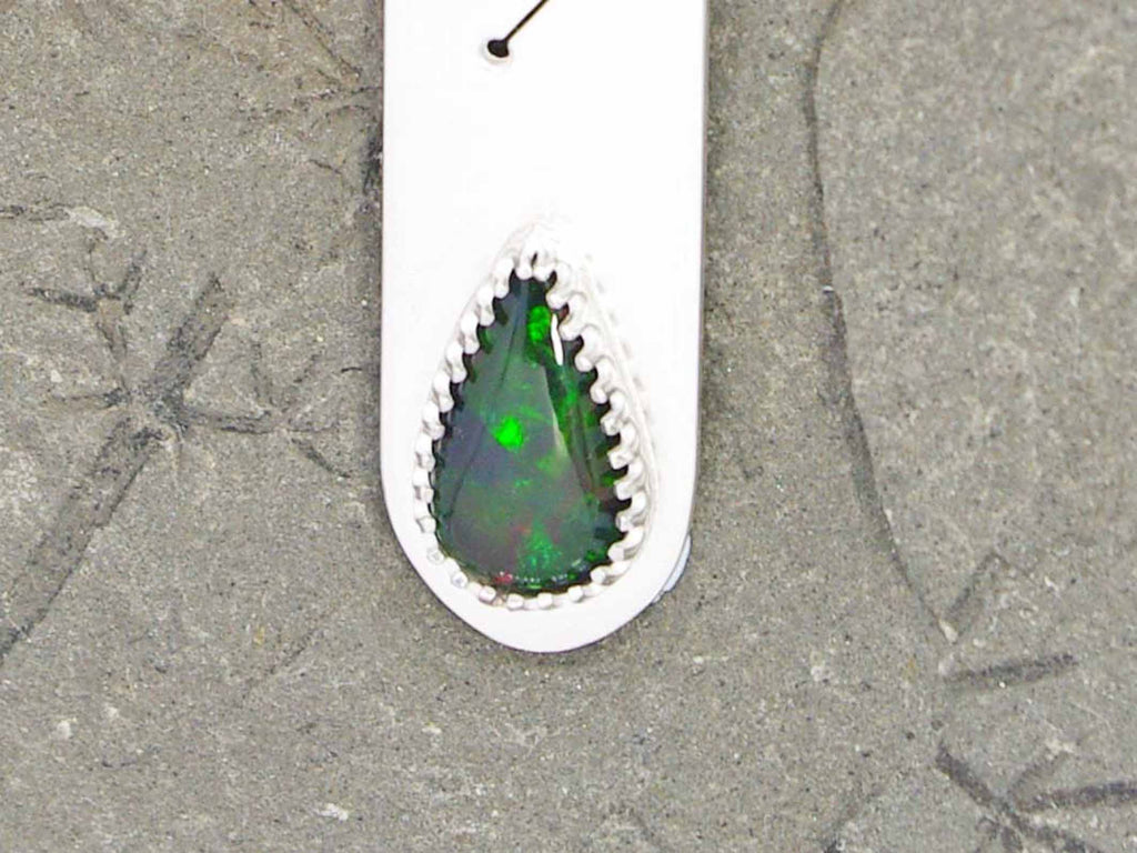 A hallmarked 18ct gold pendant set with black opal and diamond, length  1.25